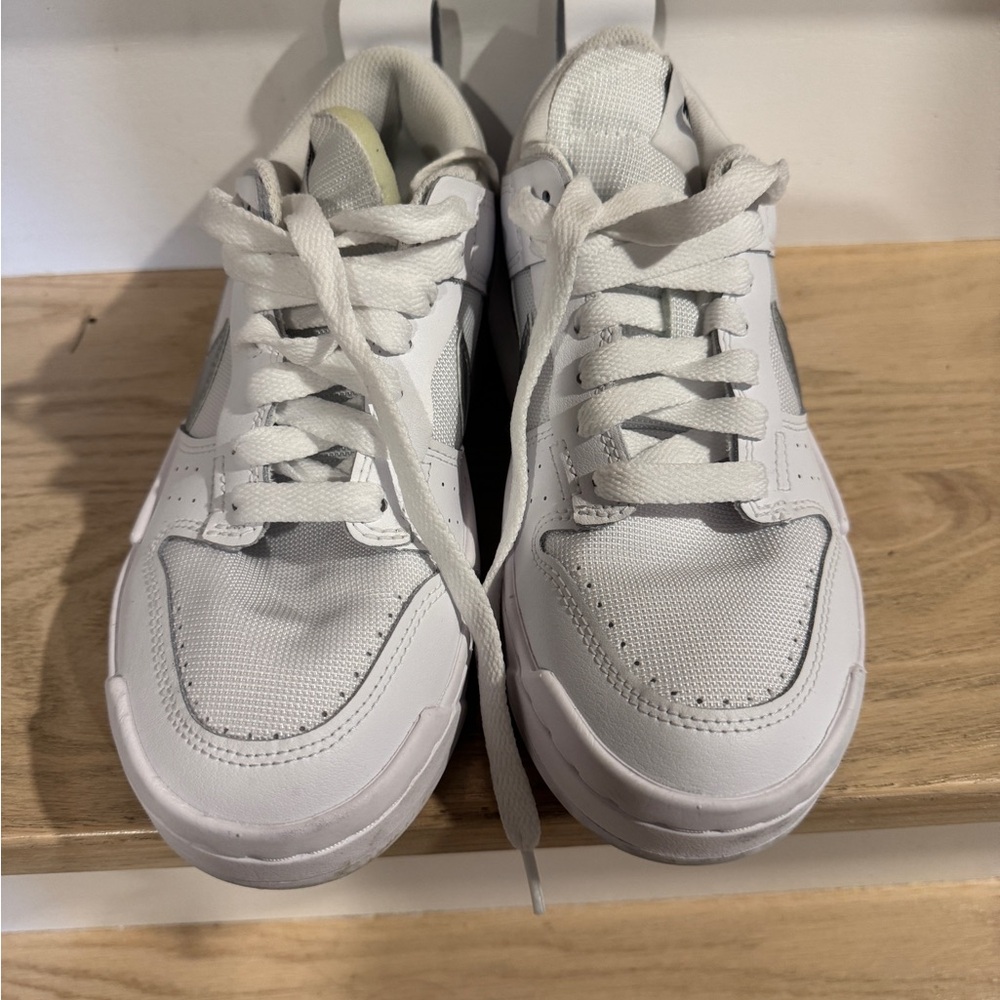 Women’s White Nike Dunk Low Athletic Shoes with silver swoosh
